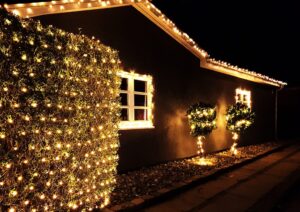 Christmas Light Installation. House with Christmas light decorations.